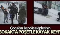 Çocuklar ile polis ekiplerinin sokakta poşetle kayak keyfi